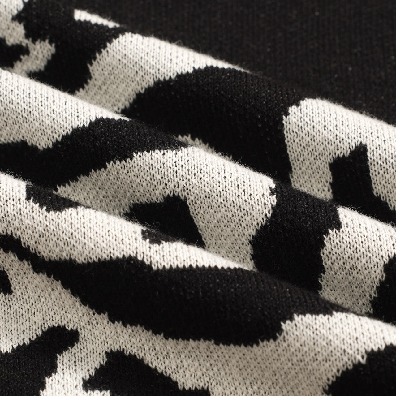 Polo tricoté vintage noir avec jacquard pour homme