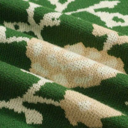 Polo tricoté à col V en jacquard floral vert pour homme