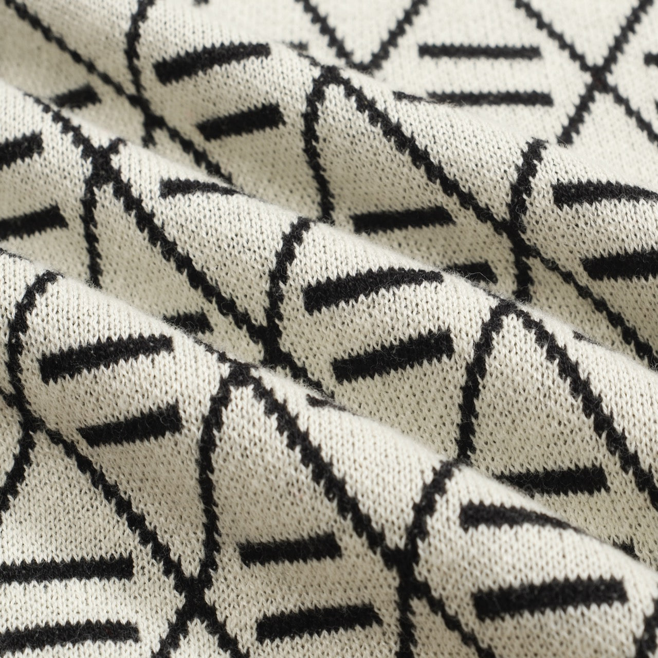 Polo en tricot noir jacquard brodé pour homme