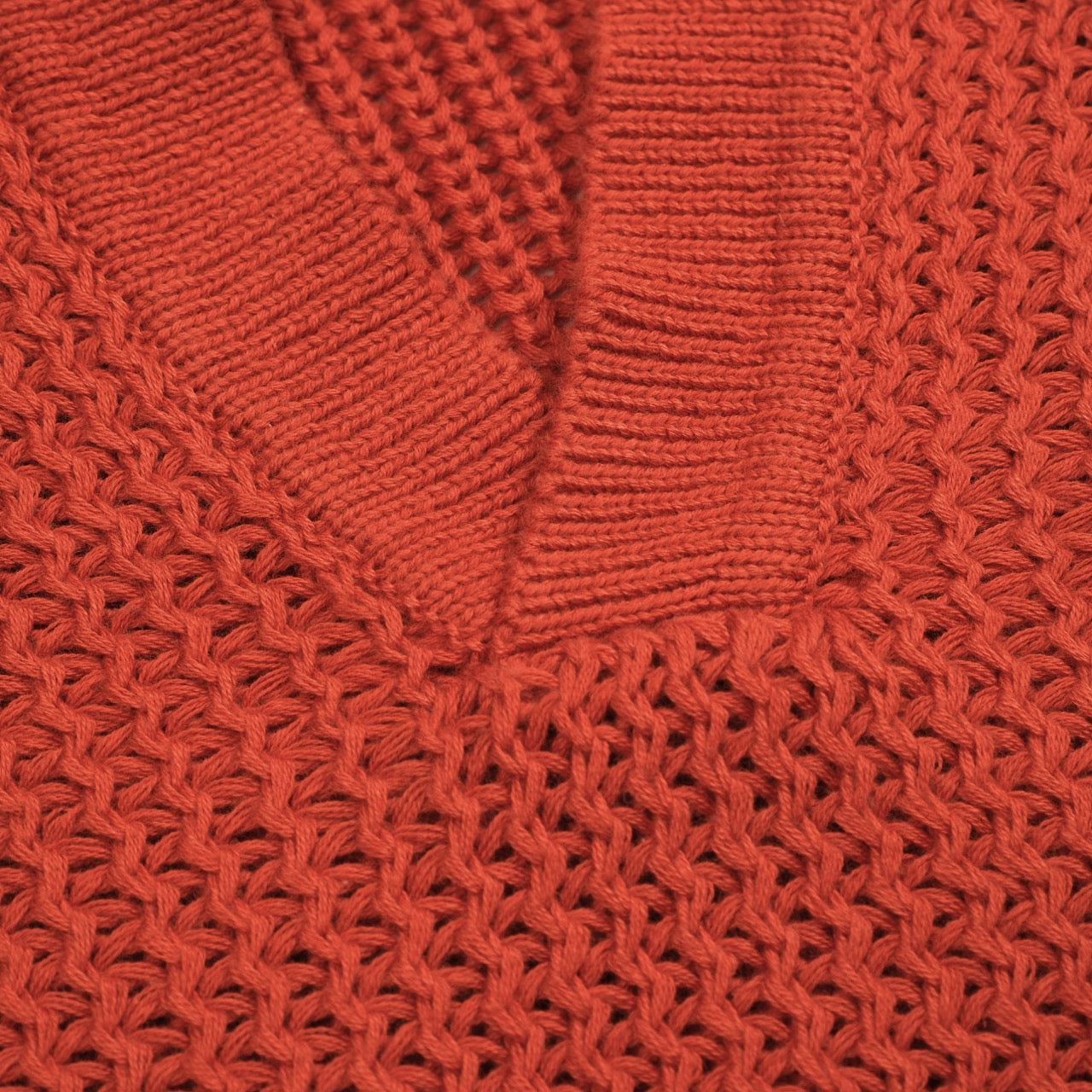 Polo vintage en tricot V en laine orange brun